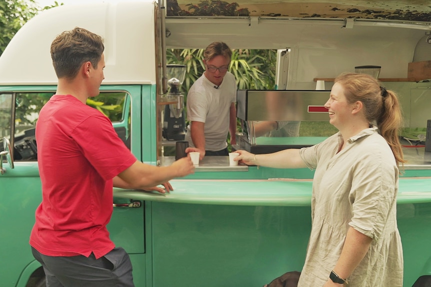 Bobby Pate serves coffee to his brother and sister from his refurbished kombi barista van.