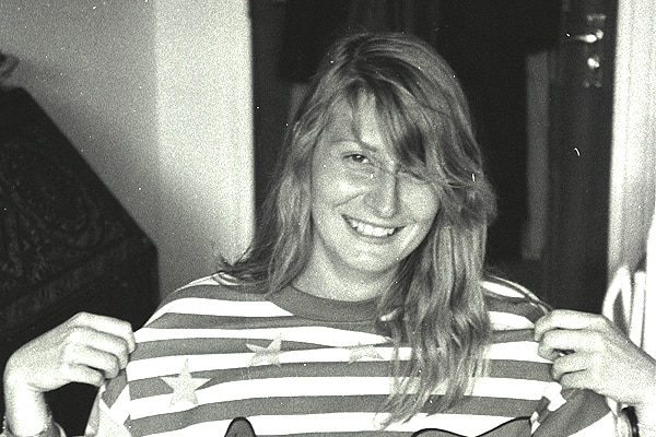Black and white photo of Victoria Cafasso wearing a striped Donald and Daisy Duck top.