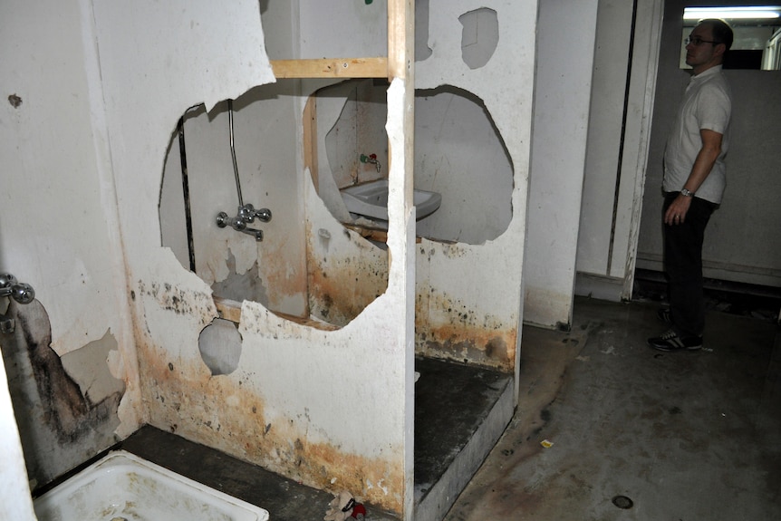 Three toilet with large holes in centre 