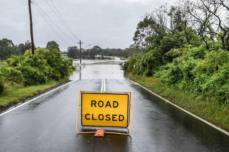 A road closure sign at an inundated road in north west NSW .