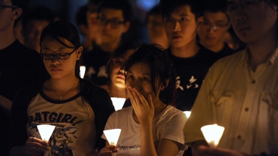 File photo: Hong Kong students hold a candlelight vigil, June 3, 2009 (Getty Images: AFP PHOTO/MIKE CLARKE)