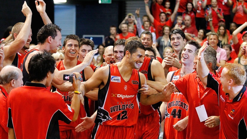 Man of the moment...Wildcats guard Kevin Lisch scored a game-high 29 points to seal Perth's fifth title.