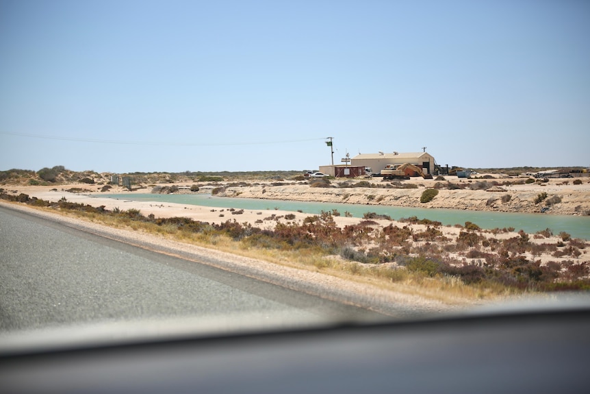 A lone building on a deserted regional road