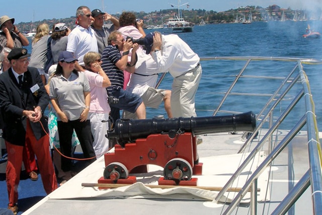 A ceremonial starting cannon is fired from a yacht.
