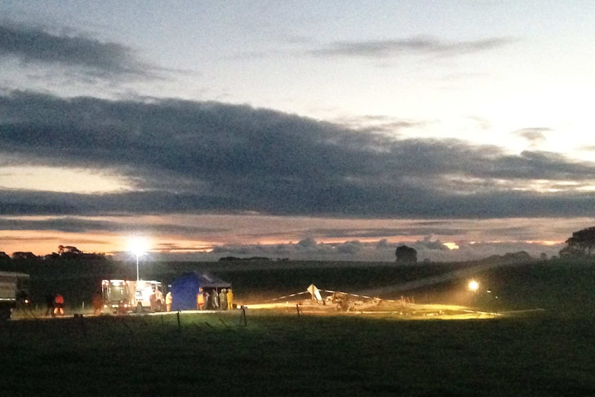 Lights at the scene of a light plane crash near Mount Gambier, after sunset.