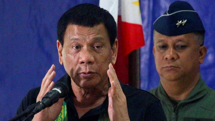 Philippine President Rodrigo Duterte speaks before soldiers.