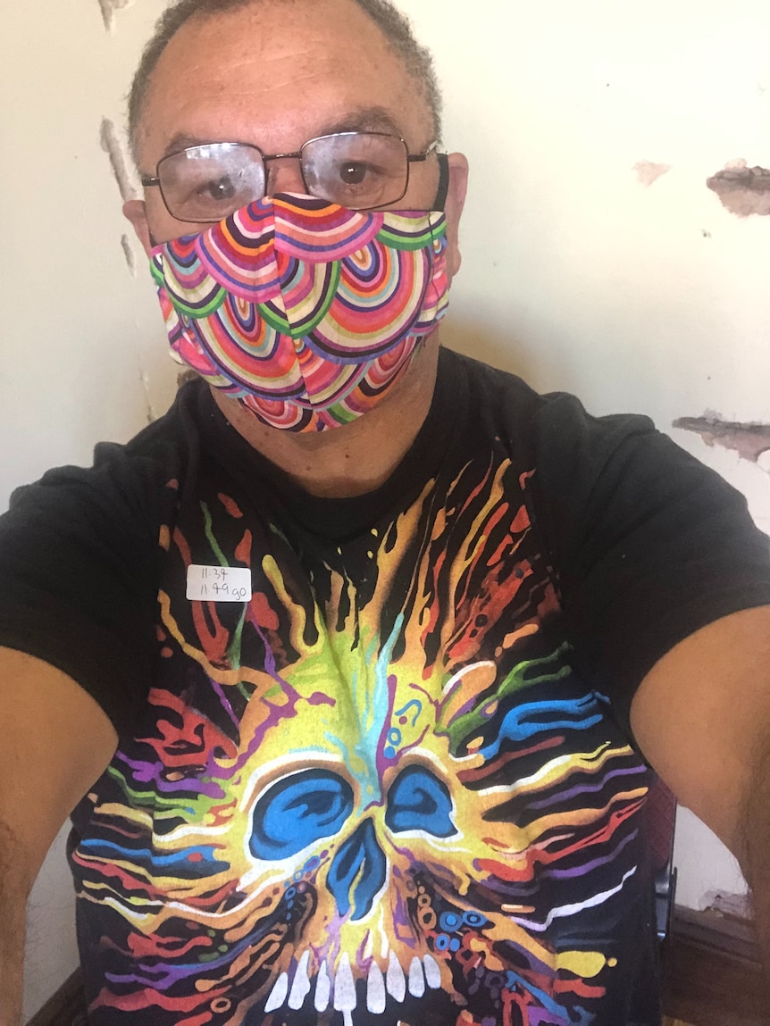 David Towney wearing a bright face mask and a black t-shirt in a selfie.