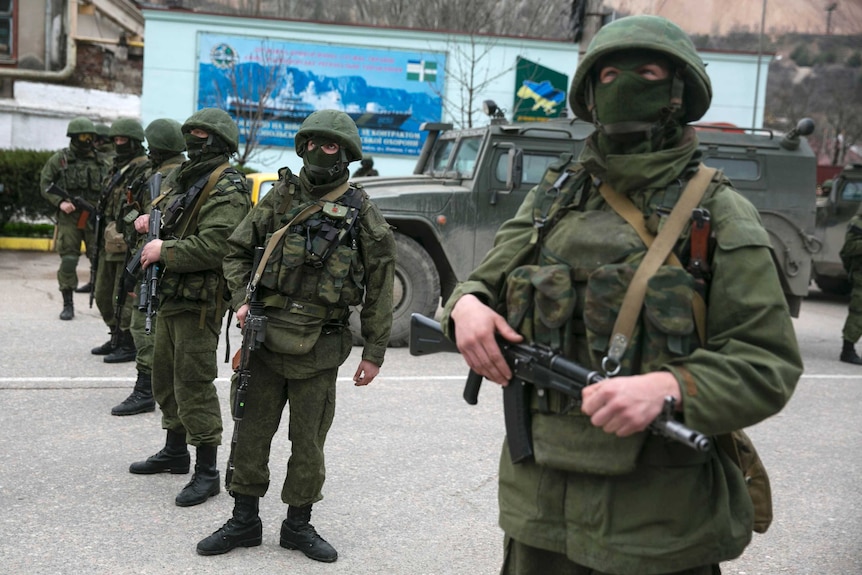 Armed servicemen outside a Ukrainian border guard post in Crimea
