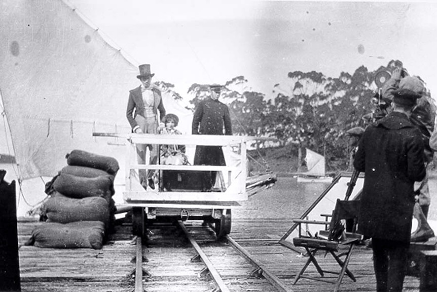 Cameras, actors and crew filming a scene of The Term of His Natural Life at Port Arthur, Tasmania in the 1920's.