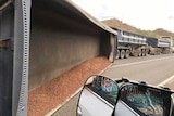 A truck rollover on an outback highway.