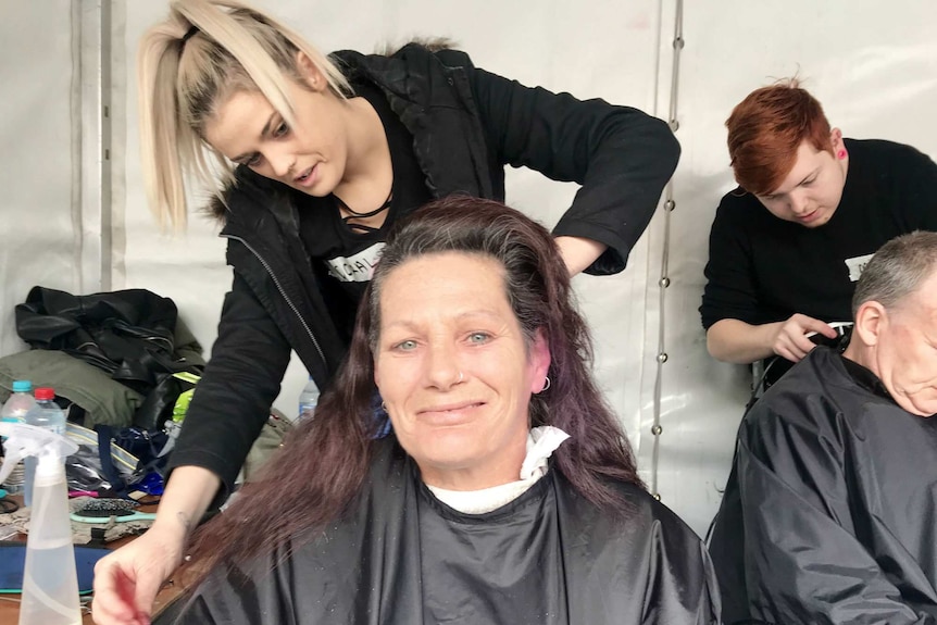 A woman getting a haircut