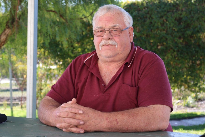 Hobart man Athol Nossiter sits at a table