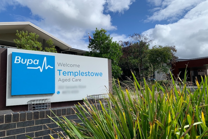 A photo of a Bupa Aged Care sign outside a nursing home.