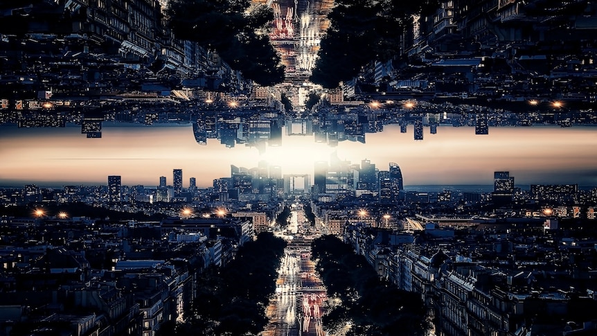 The mirror image of a cityscape reflected in the sky
