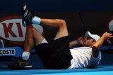 Roddick was not overly impressed after taking a tumble over the line's judge.
