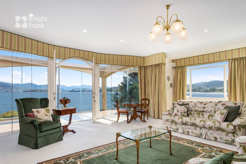 A view of the living room looking out over the water.