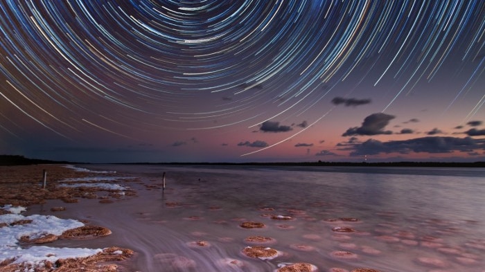 A star trail above a natural pool in Western Australia.