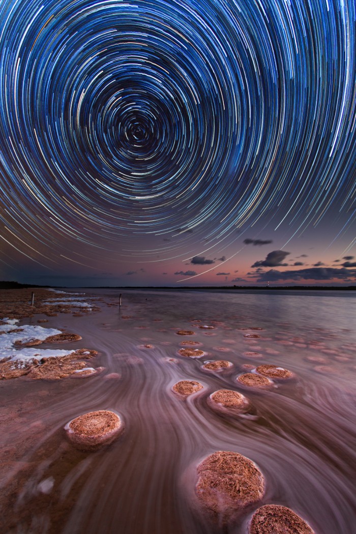 A star trail above a natural pool in Western Australia.