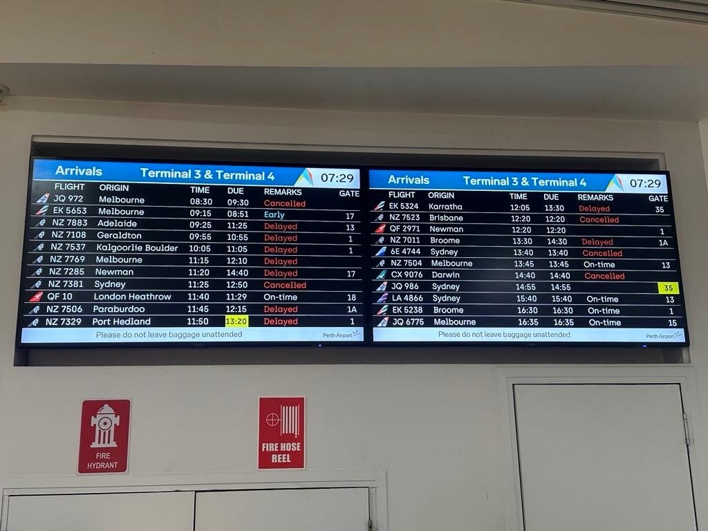 Perth airport board showing cancelled flights