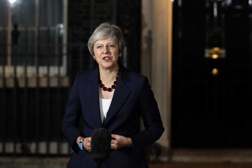 Theresa May talks to media outside 10 Downing Street