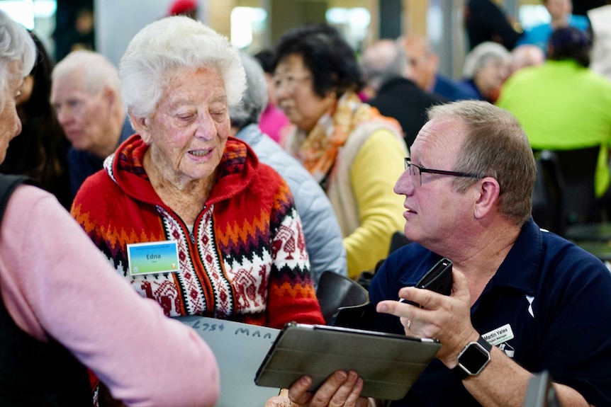 89 year old Edna Cable with trainer Martin Yates at the tech savvy seniors seminar in Perth