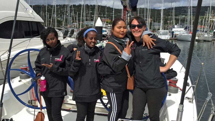 Migrant girls on a yacht with MRC worker
