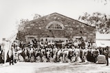 An old photo of shearers outside a woolshed in the 1880s.