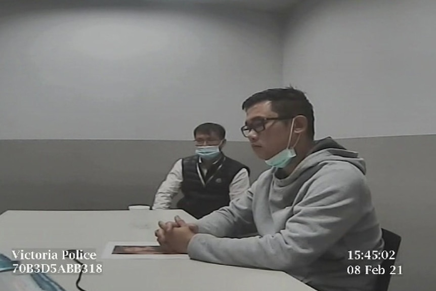 Two men in a police interrogation room
