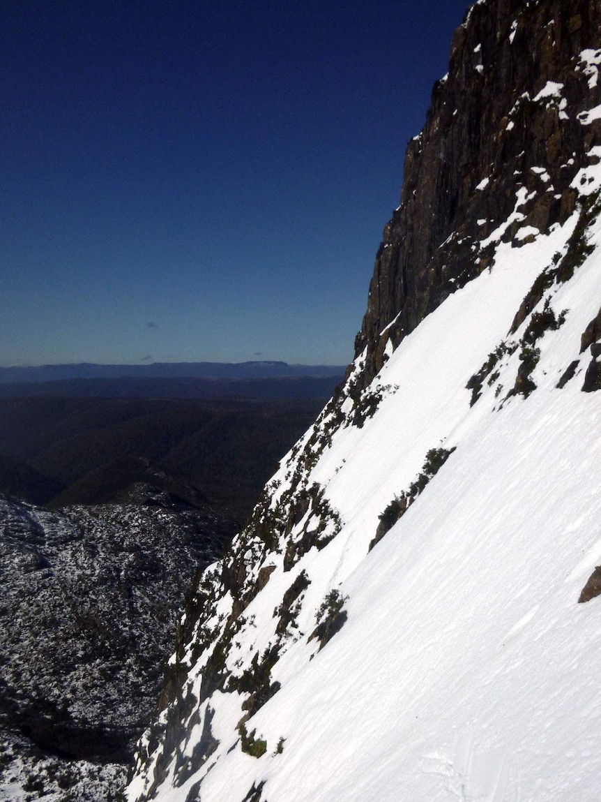 A precipitous, snowy drop on the east face of Cradle Mountain.