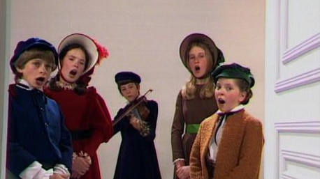 Five children sing in period costume