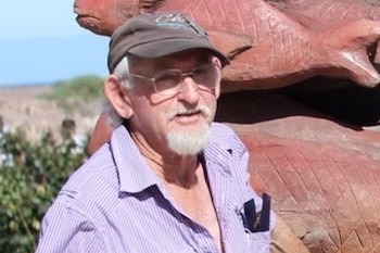 A man in a cap and glasses.