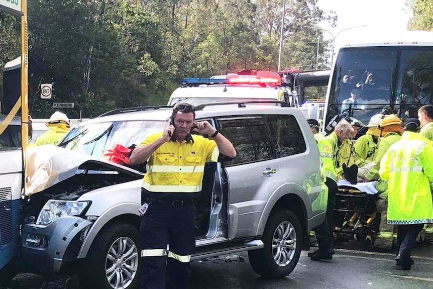Emergency authorities at the scene of a car and bus crash