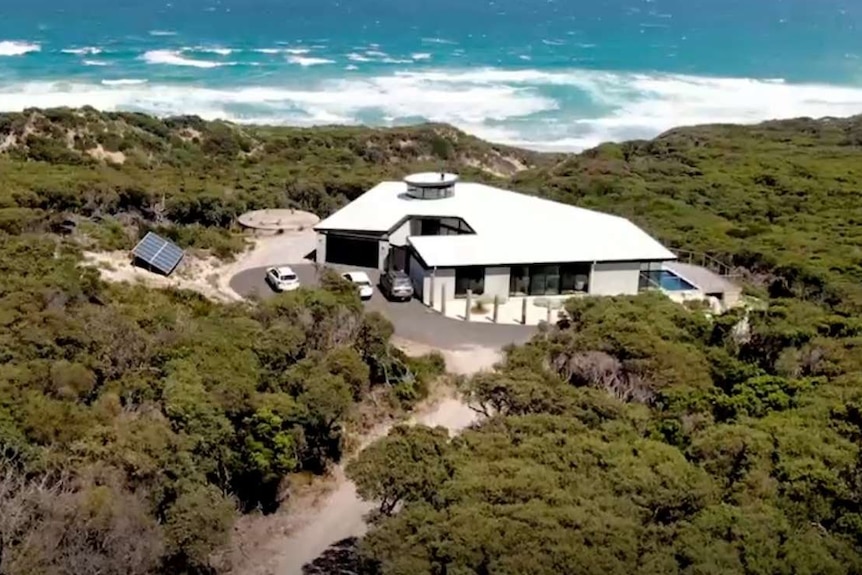 Drone view over coast and house