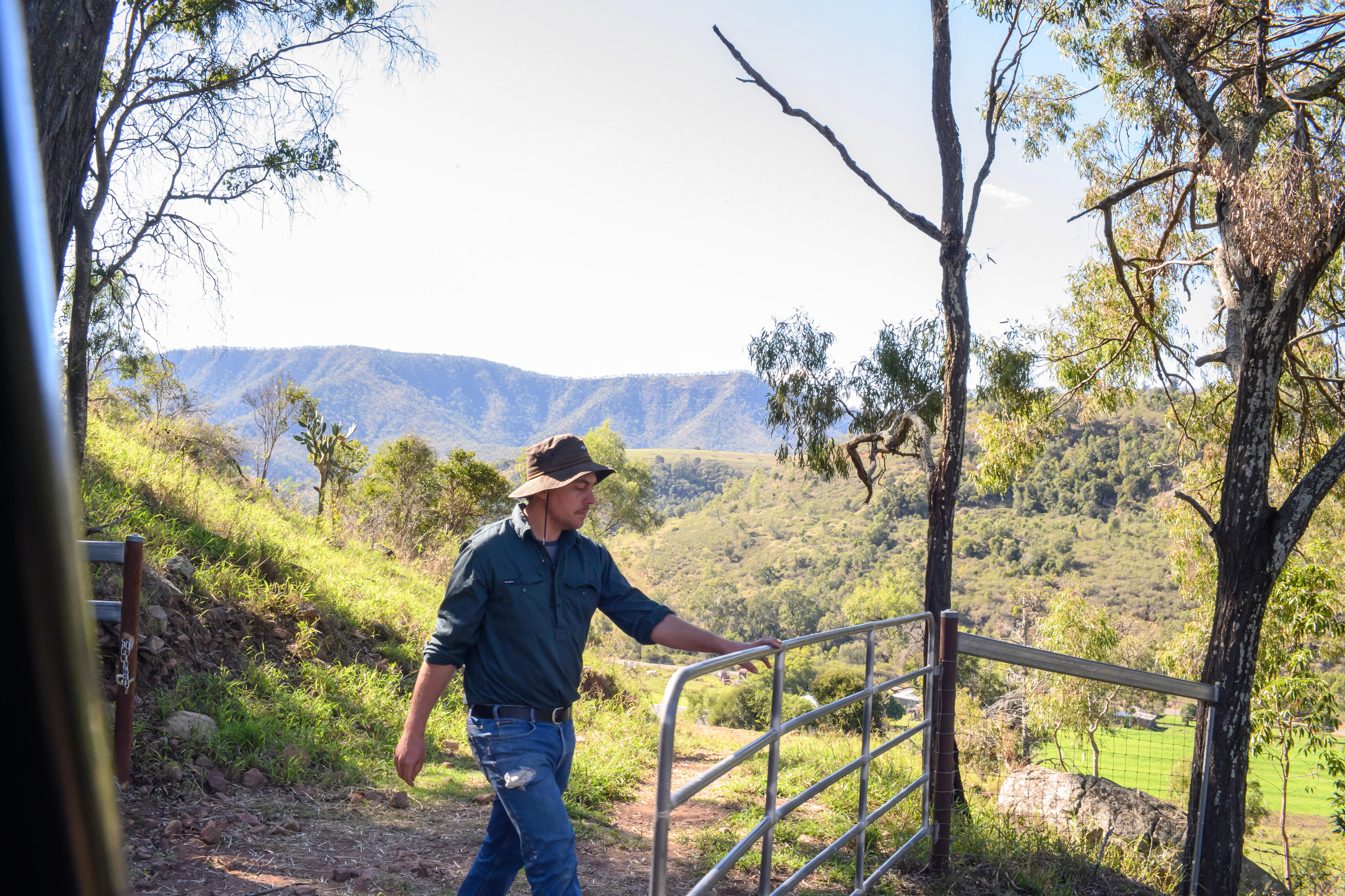 a man opens a gate