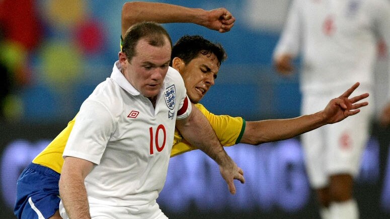 Rooney takes on Brazilian defence