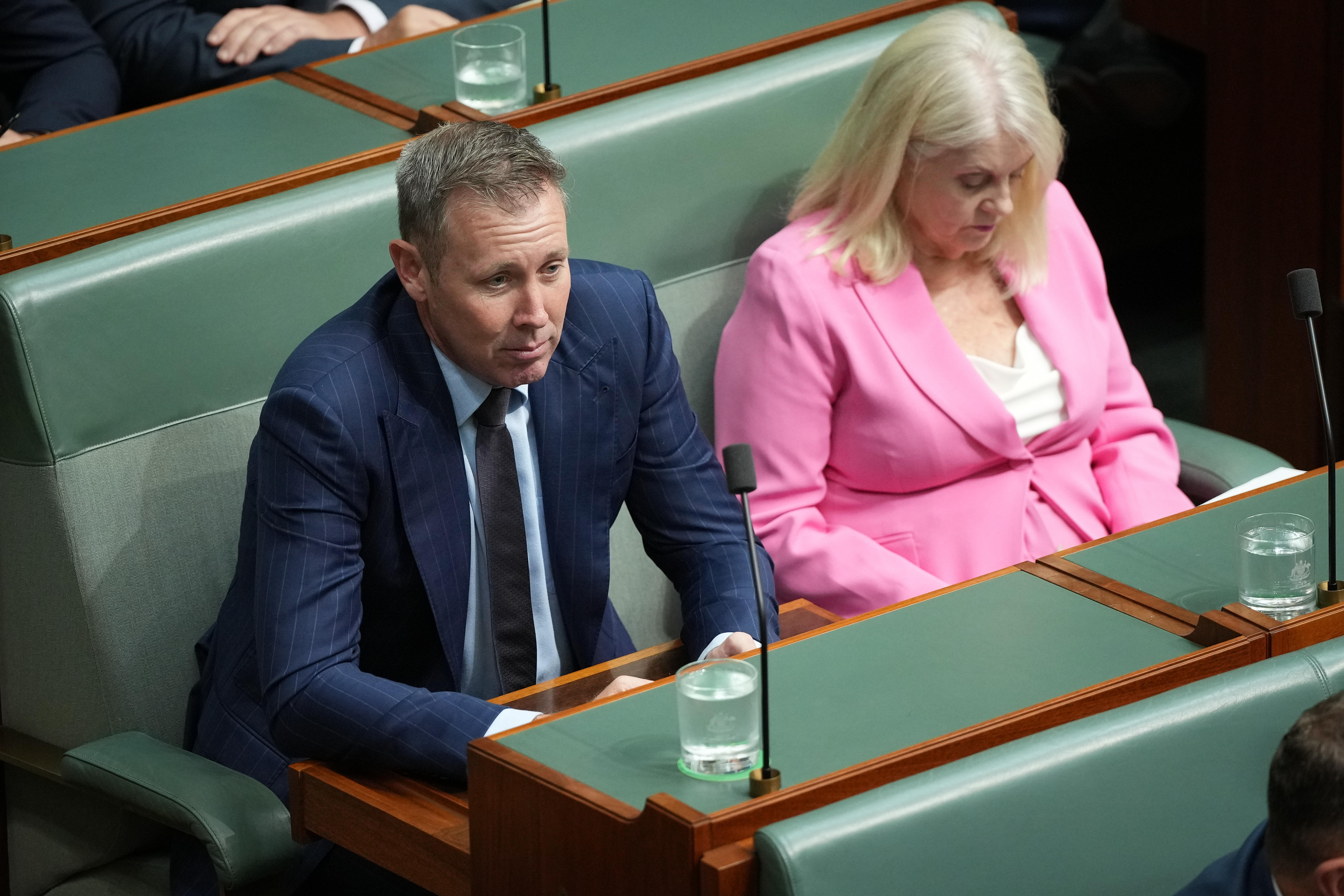 Garth Hamilton leans forward while seated.