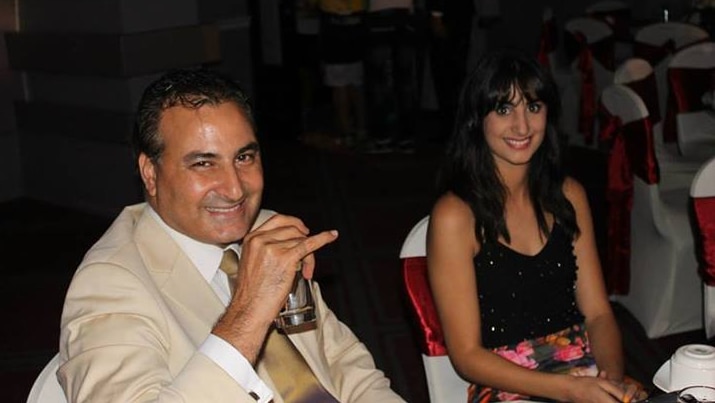 Hazem Hamouda, left, and his daughter Lamisse at a function in Cairo in 2014.