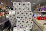 Trolley loaded with toilet paper at an Australian supermarket in coronavirus story about why everyone's buying toilet paper.