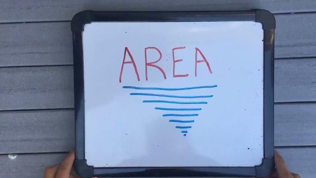 Small whiteboard with text "Area"