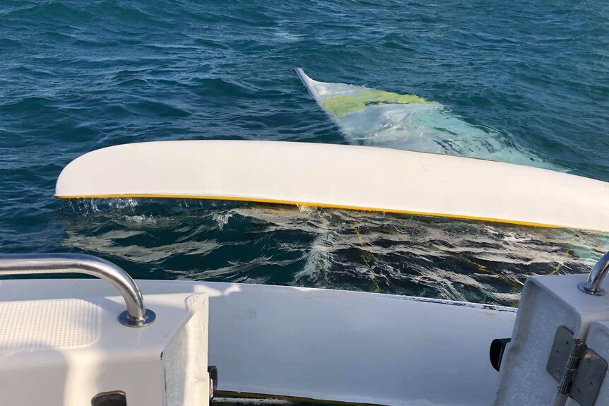 A catamaran sinks in waters off Hervey Bay.