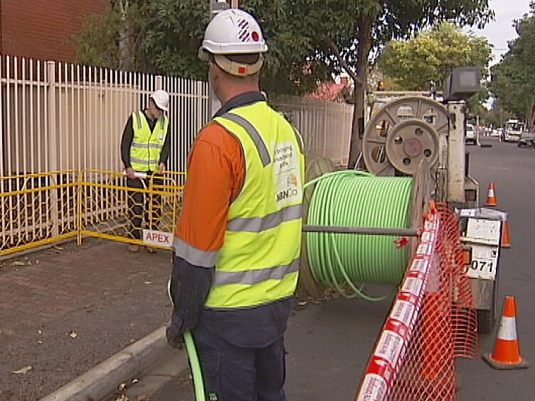 Workers lay the NBN cable at Prospect