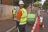 Workers lay the NBN cable at Prospect
