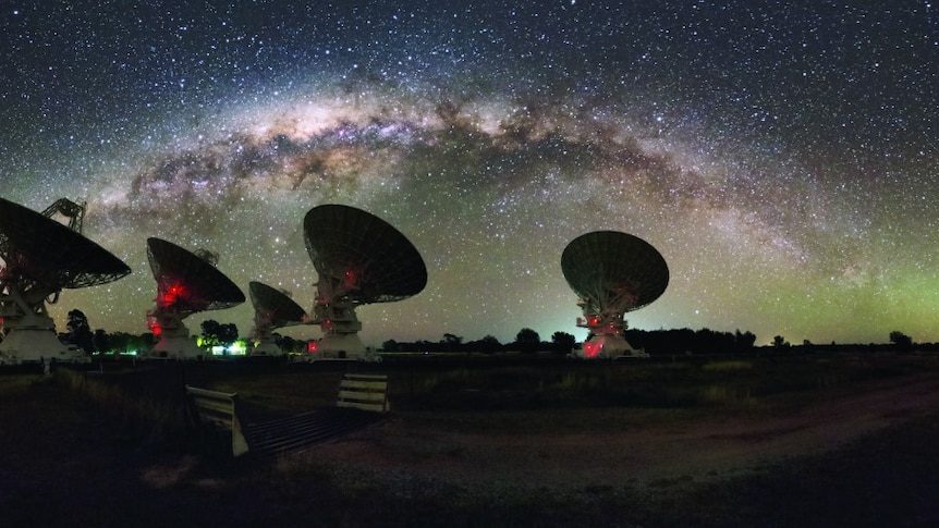CSIRO's Compact Array in Australia beneath a star-filled sky featuring the Milky Way.