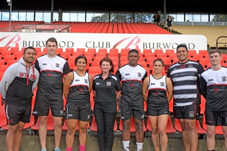 West Harbour President Siobhan Seiuli poses with players from the embattled rugby union club