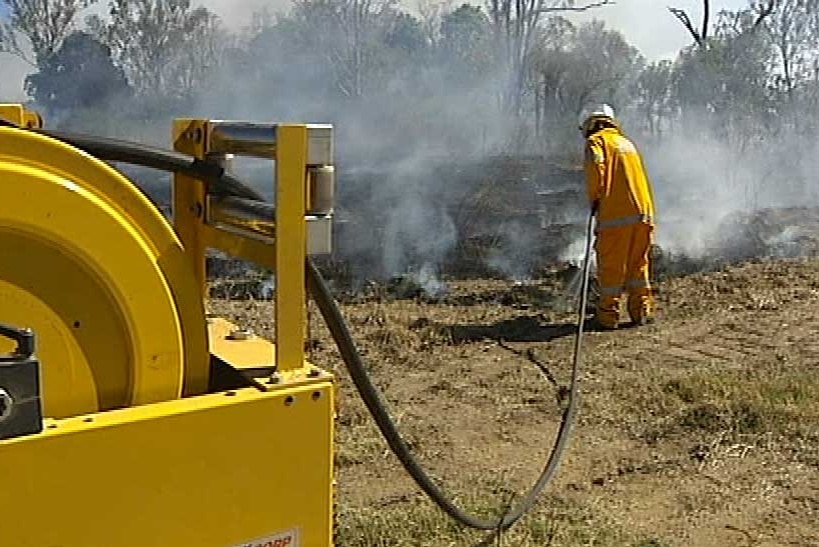 Rural firefighter back-burning in bushland in far north Queensland.