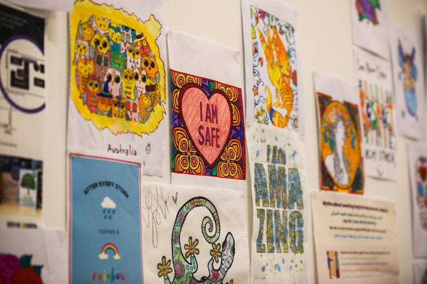 A brightly-coloured "I am Safe" drawing hangs on the wall at the East Perth Safe Night Space facility.