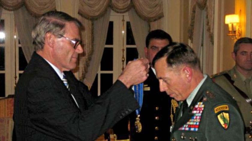 John Faulkner presents the honorary Order of Australia to General David Petraeus.