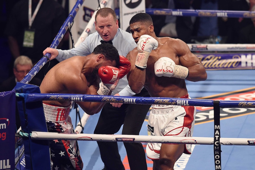Anthony Joshua pummels Dominic Breazeale in the corner