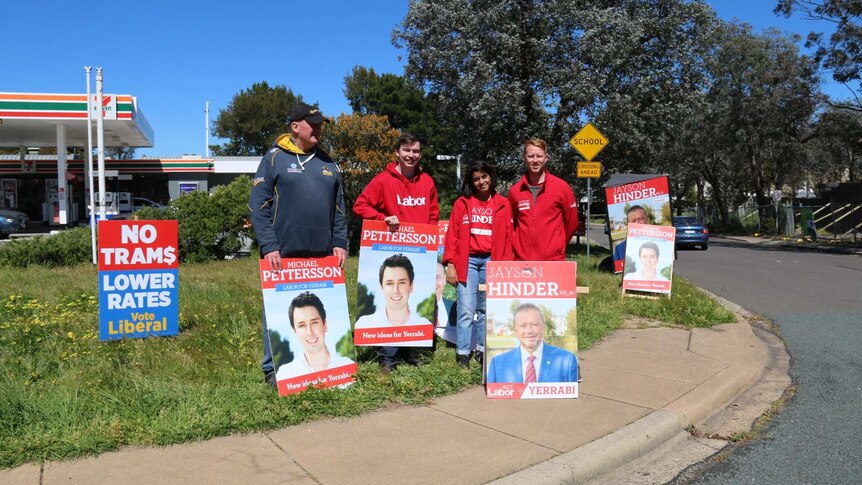 ACT Labor party volunteers standing on the corner near Giralang primary with candidate signs.