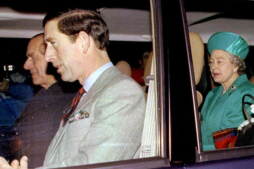 Prince Philip, Prince Charles, the Queen and her mother in a car.